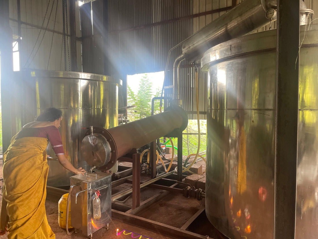 Work beside the distillation vessels and condenser at Sugandha in Konkan.